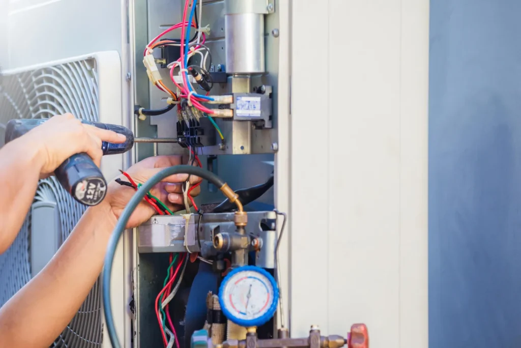 Method Air HVAC technician working on an external heat pump unit.